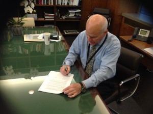 John Gray signing Middlebury College MOU