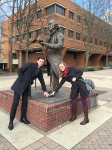 Sean Butler from the Smithsonian Office of Human Resources and intern Lynea Wilson rub George Mason’s Foot for good luck, as is Mason tradition.