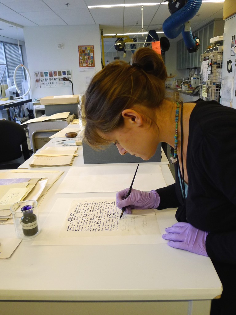 Laura Dellapiana working on a sample of the letterpress copying books of Spencer Fullerton Baird.