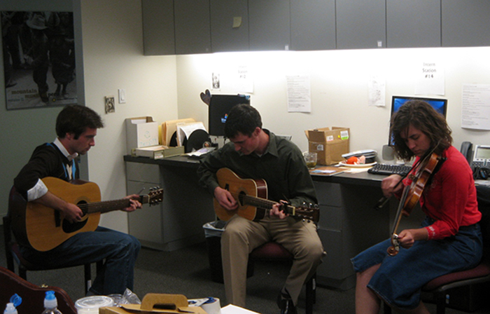 Douglas Peach, Folkways marketing director David Horgan, and Emily Hilliard—then a Folkways intern and now state folklorist of West Virginia—jamming in the Folkways offices. Photo courtesy of Douglas Peach